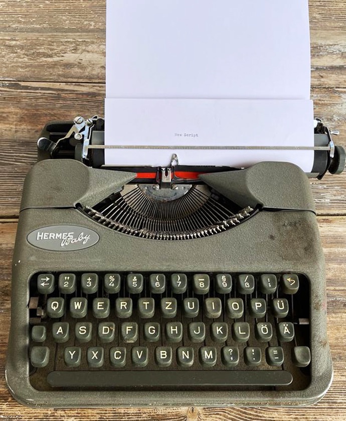 old typewriter with new script